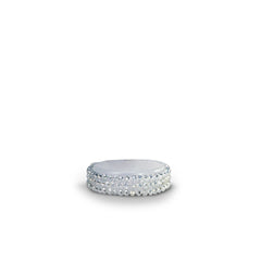 Silver band ring with multiple rows of sparkling crystal or diamond-like stones set around the entire band.