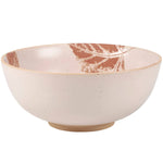 Cream ceramic bowl with terracotta leaf design and speckled glaze finish.