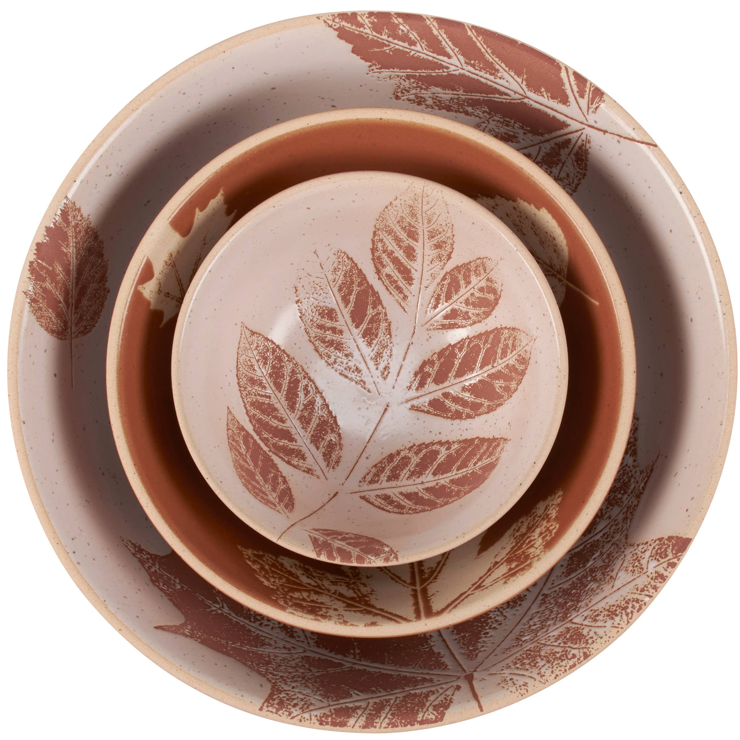 Nested ceramic bowls with rust-red leaf motifs in varying sizes, arranged concentrically on a white background.