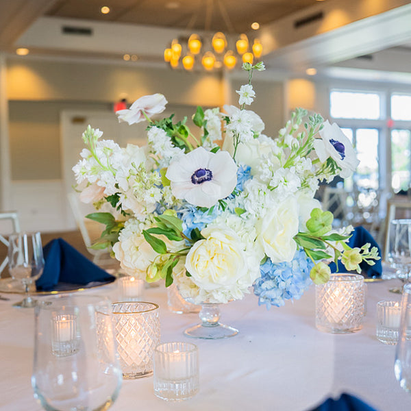 White and blue wedding centerpiece by The Flower Bar, Larchmont NY