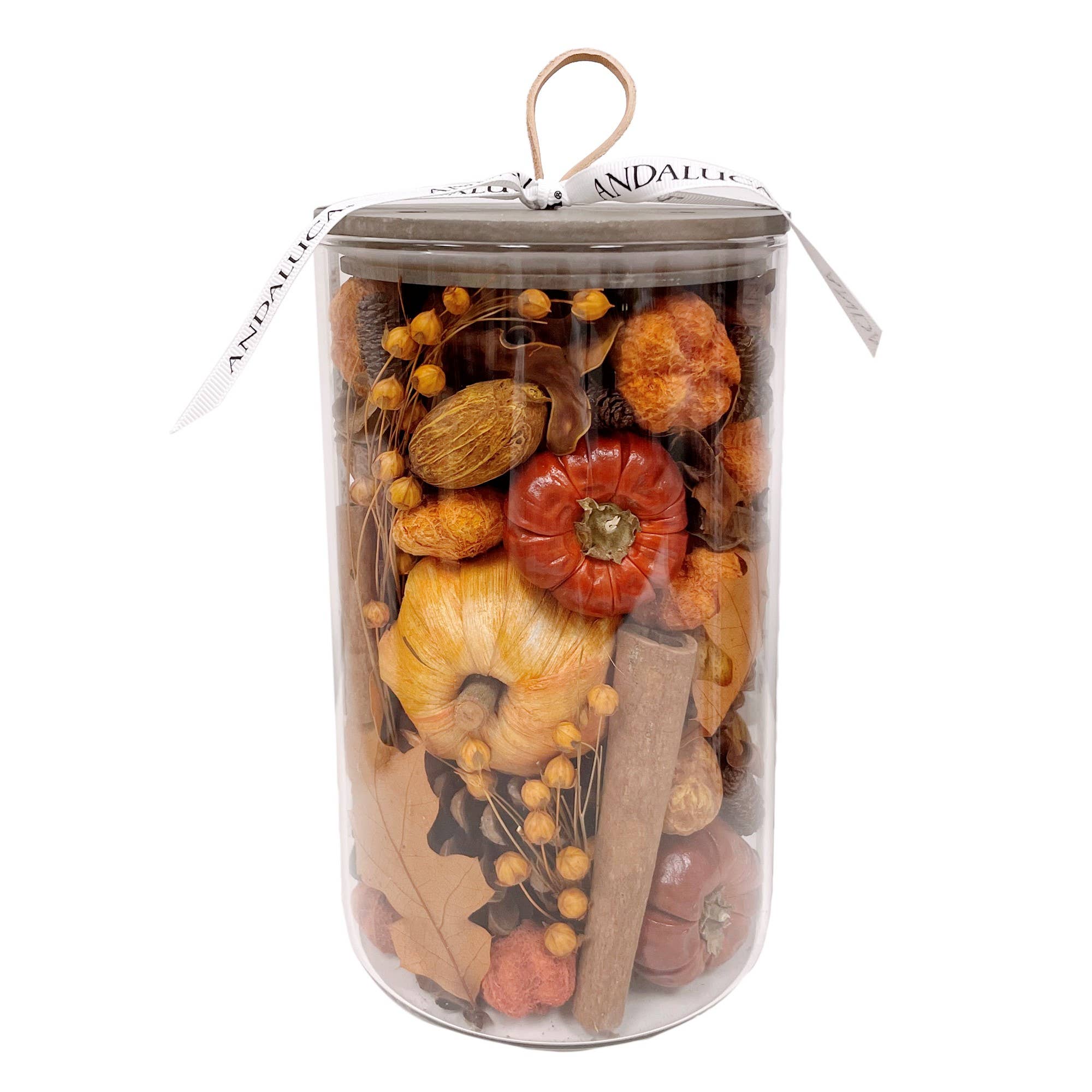 Clear cylindrical container filled with dried flowers and botanicals in orange, red, and natural tan tones with a wooden stem.