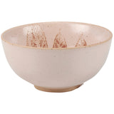 Cream ceramic bowl with speckled glaze featuring dried pampas grass arrangement in warm bronze tones.