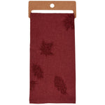 Burgundy tissue wrap with embossed maple leaf pattern displayed on kraft paper backing.