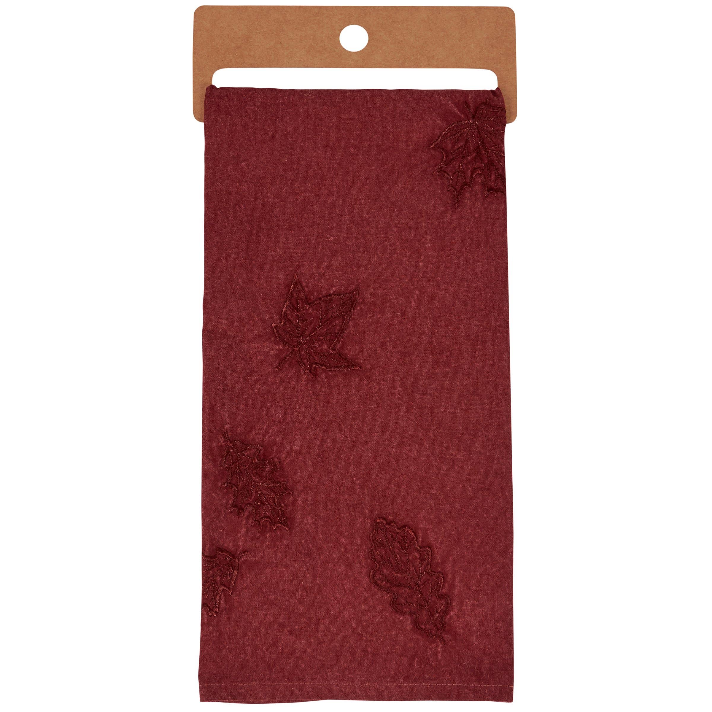 Burgundy tissue wrap with embossed maple leaf pattern displayed on kraft paper backing.