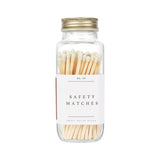 Glass jar filled with cream-colored safety matches, labeled "No. 40 Safety Matches" with a brass screw-top lid.