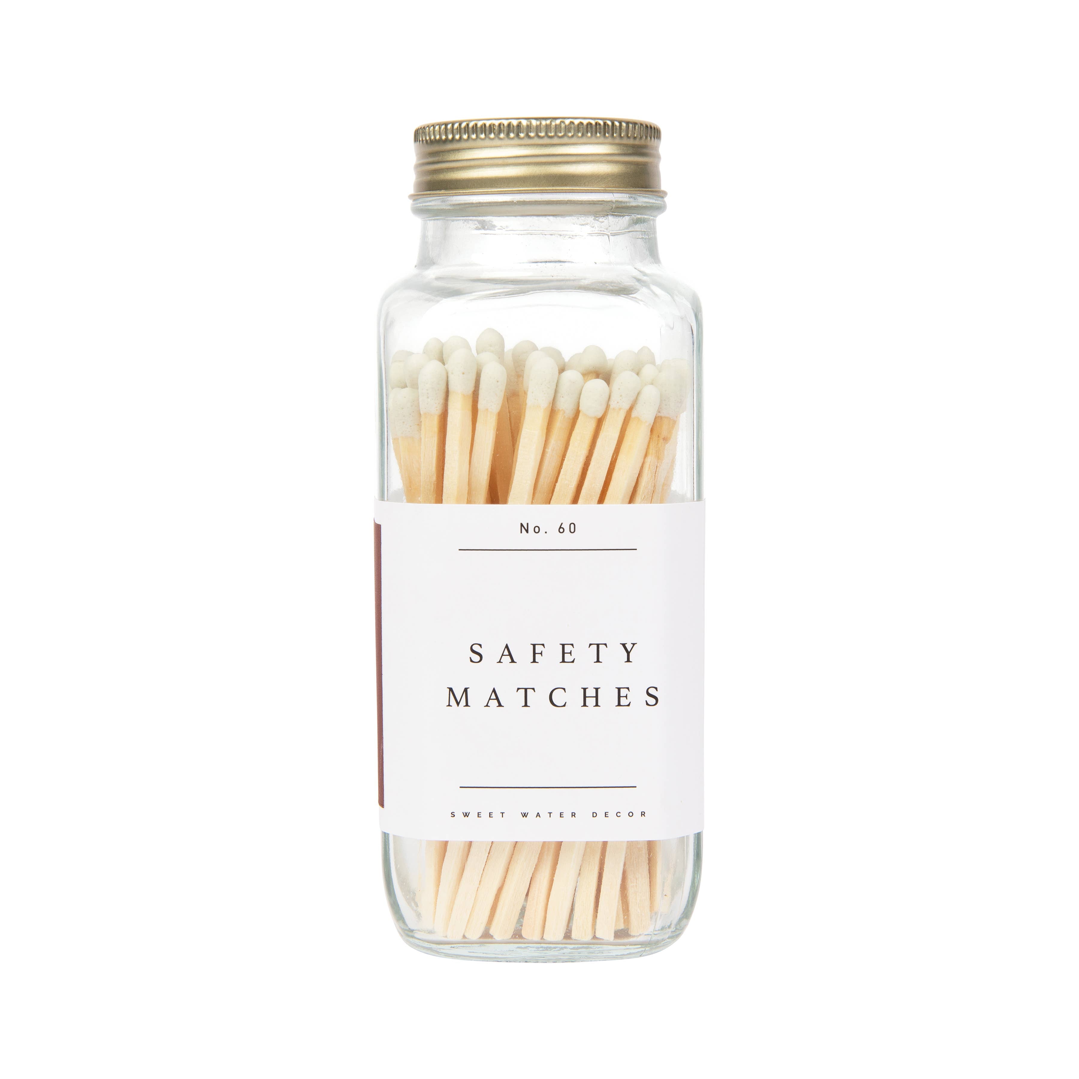 Glass jar filled with cream-colored safety matches, labeled "No. 40 Safety Matches" with a brass screw-top lid.